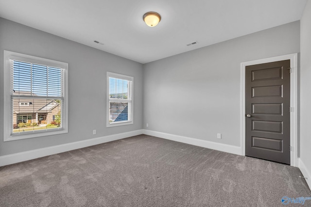 view of carpeted spare room