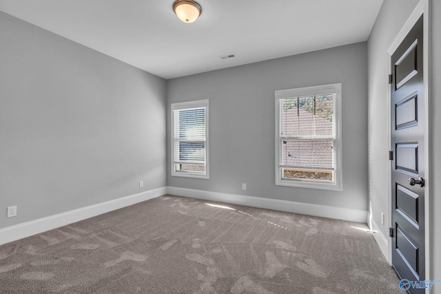 unfurnished room with carpet