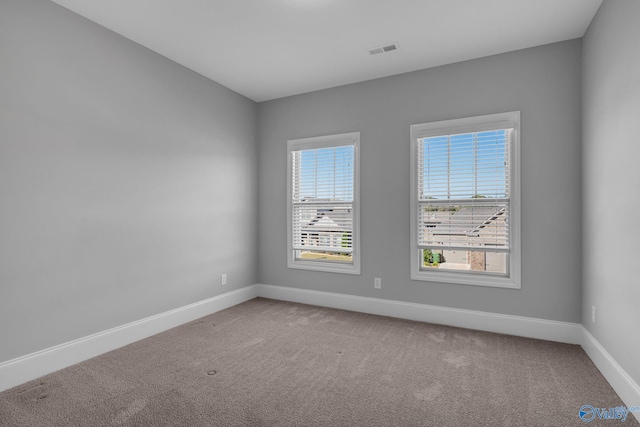 empty room featuring carpet flooring