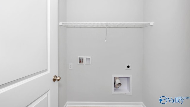clothes washing area with electric dryer hookup, hookup for a washing machine, laundry area, and baseboards