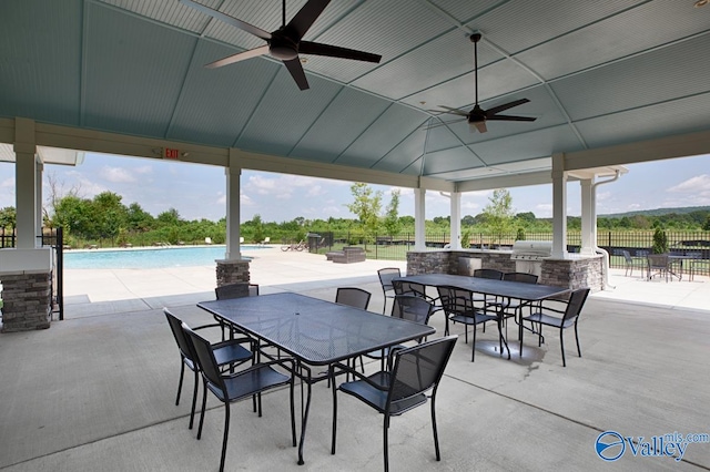 view of patio / terrace featuring fence, a ceiling fan, area for grilling, and outdoor dining area