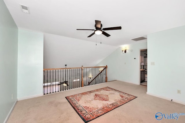 bonus room with vaulted ceiling, visible vents, ceiling fan, and light carpet