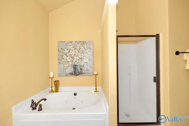 bathroom with a garden tub and a shower stall