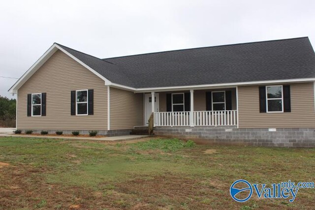 unfinished property with a front yard