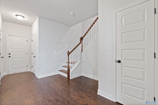 foyer with dark hardwood / wood-style floors