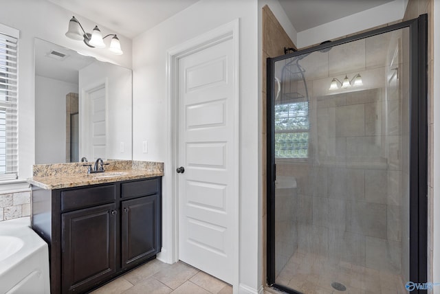 bathroom with vanity, shower with separate bathtub, and tile patterned floors