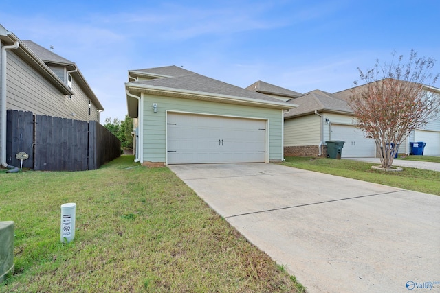 ranch-style house with a garage and a front lawn