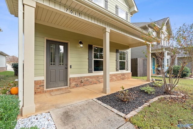 doorway to property with a porch