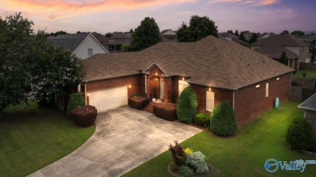 7515 Park Trace Ln SE, Owens Cross Roads, AL 35763 - view of front of house featuring brick siding, driveway, an attached garage, and a lawn