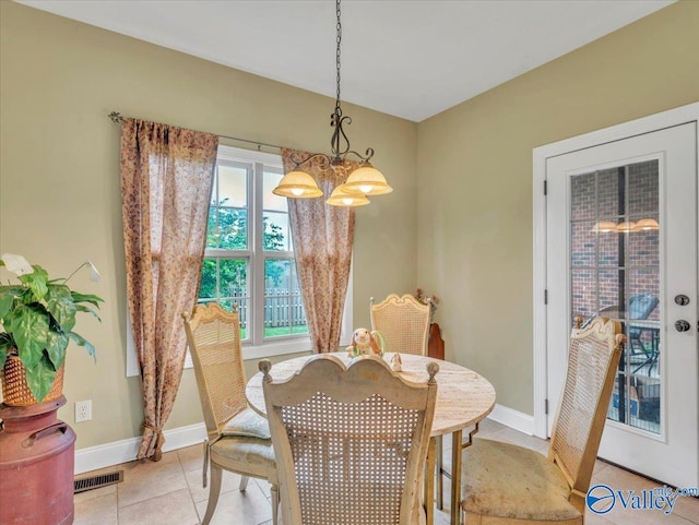7515 Park Trace Ln SE, Owens Cross Roads, AL 35763 - dining space featuring a chandelier and light tile patterned floors
