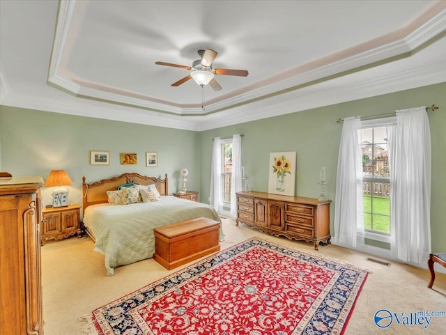 7515 Park Trace Ln SE, Owens Cross Roads, AL 35763 - bedroom featuring carpet flooring, a tray ceiling, crown molding, and ceiling fan