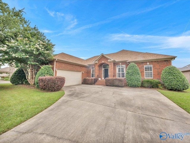 7515 Park Trace Ln SE, Owens Cross Roads, AL 35763 - view of front of property with brick siding, a garage, a front yard, concrete driveway, and a shingled roof