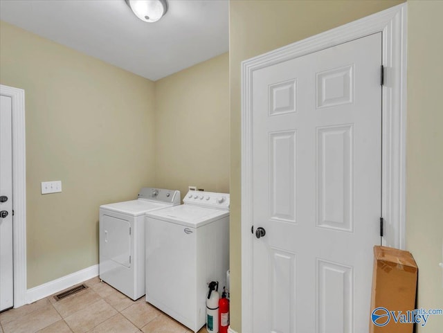 7515 Park Trace Ln SE, Owens Cross Roads, AL 35763 - laundry room featuring independent washer and dryer and light tile patterned floors