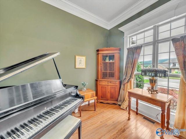 7515 Park Trace Ln SE, Owens Cross Roads, AL 35763 - sitting room with light wood finished floors and ornamental molding
