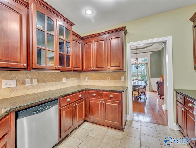 7515 Park Trace Ln SE, Owens Cross Roads, AL 35763 - kitchen featuring stainless steel dishwasher, glass insert cabinets, light tile patterned flooring, backsplash, and a chandelier