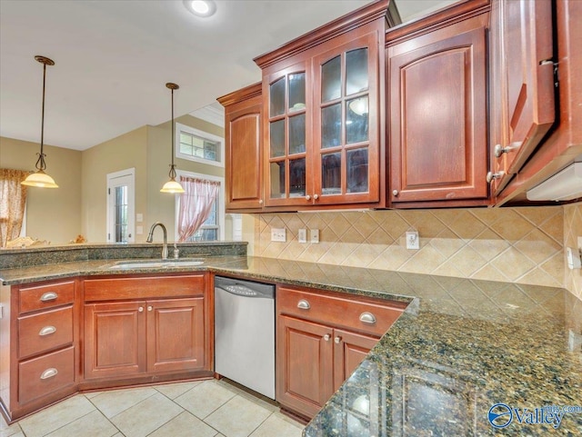 7515 Park Trace Ln SE, Owens Cross Roads, AL 35763 - kitchen with stainless steel dishwasher, decorative backsplash, hanging light fixtures, and glass insert cabinets
