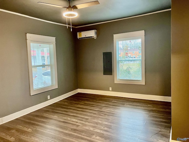 empty room featuring a wall mounted air conditioner, electric panel, hardwood / wood-style flooring, and ornamental molding
