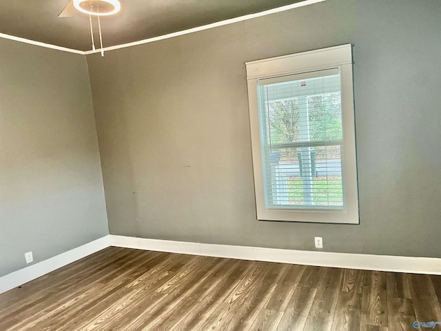empty room featuring hardwood / wood-style flooring, ceiling fan, and ornamental molding