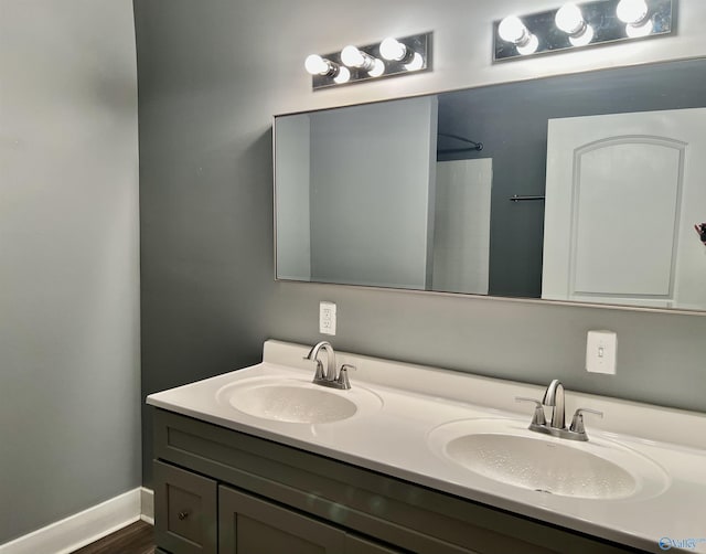 bathroom featuring hardwood / wood-style floors and vanity