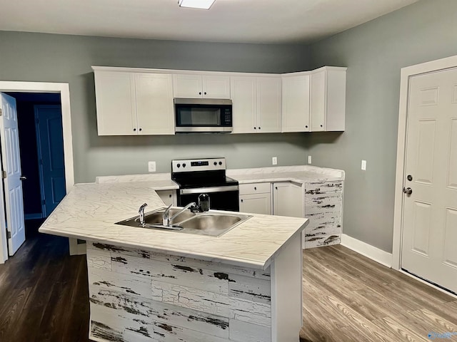 kitchen with white cabinets, sink, and stainless steel appliances