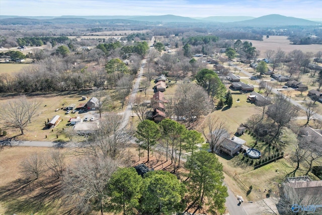 birds eye view of property with a mountain view