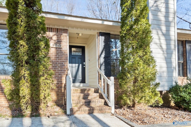 entrance to property with brick siding