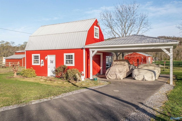 3602 Beason Cove Rd, Steele, AL 35987 - view of barn featuring a yard, fence, a carport, and aphalt driveway