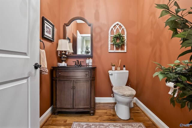 3602 Beason Cove Rd, Steele, AL 35987 - half bathroom featuring toilet, wood finished floors, vanity, and baseboards