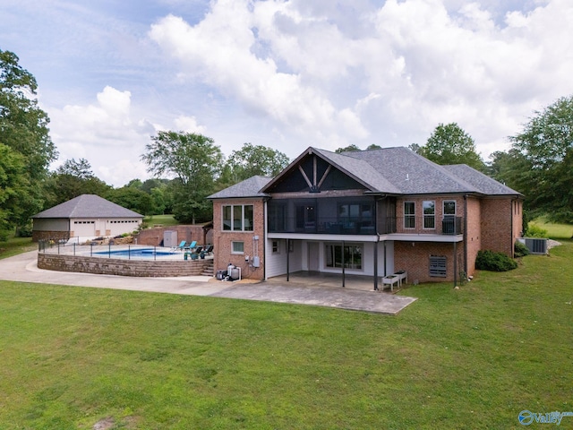 139 Summit Pt, Guntersville, AL 35976 - back of house featuring brick siding, cooling unit, a patio area, a detached garage, and a balcony