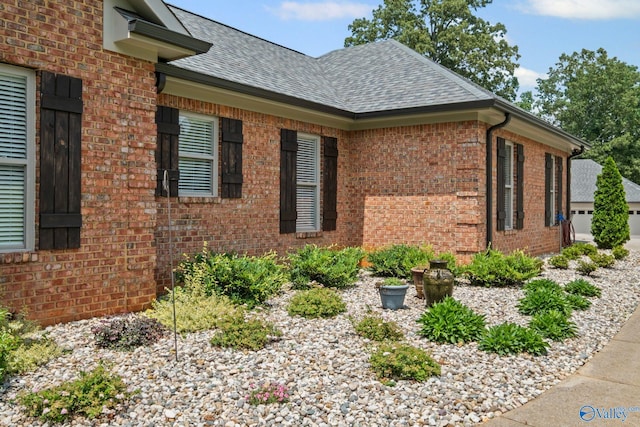 139 Summit Pt, Guntersville, AL 35976 - view of property exterior with brick siding and roof with shingles
