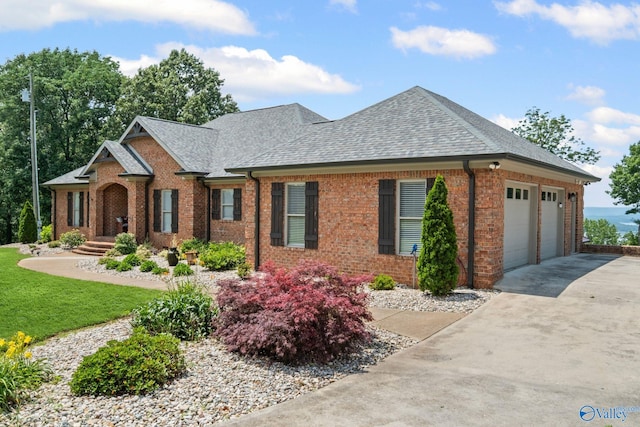 139 Summit Pt, Guntersville, AL 35976 - view of front of property with brick siding, roof with shingles, an attached garage, and driveway