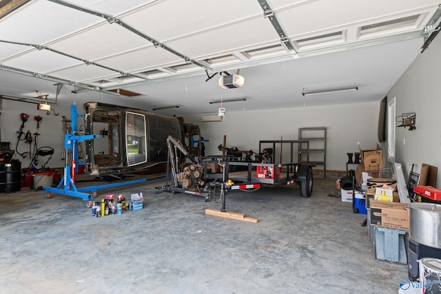 139 Summit Pt, Guntersville, AL 35976 - garage featuring a garage door opener