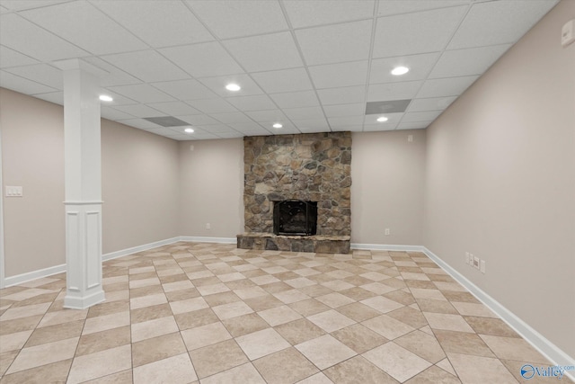 unfurnished living room featuring a stone fireplace, recessed lighting, and baseboards