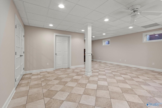 basement with light tile patterned floors, recessed lighting, baseboards, and a paneled ceiling