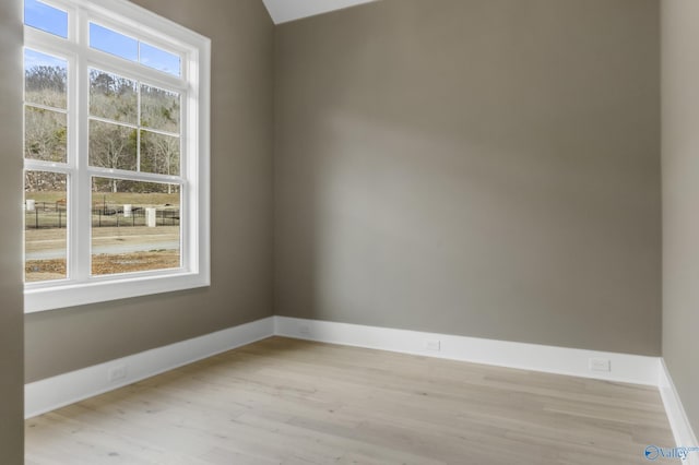 unfurnished room with light hardwood / wood-style flooring