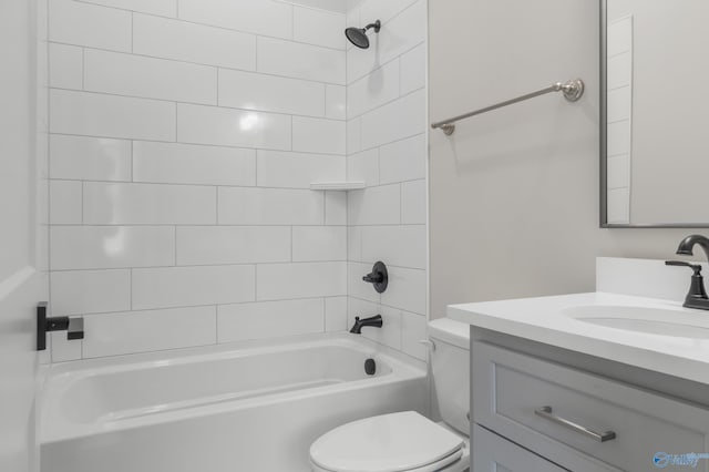 full bathroom featuring vanity, toilet, and tiled shower / bath combo