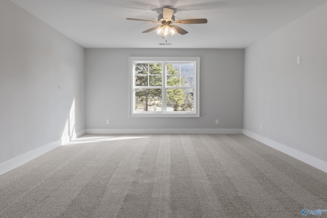 spare room with ceiling fan and carpet floors