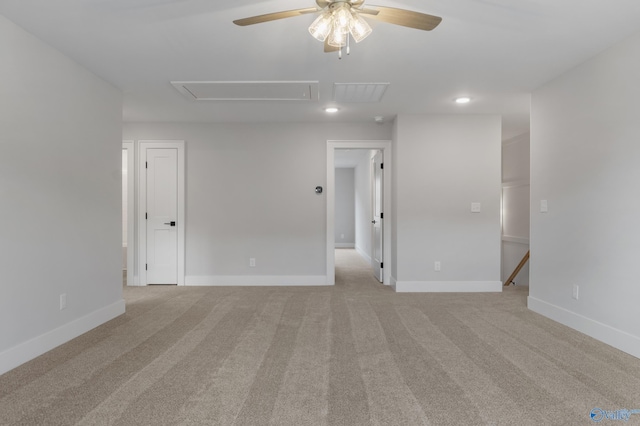 unfurnished room featuring light carpet and ceiling fan