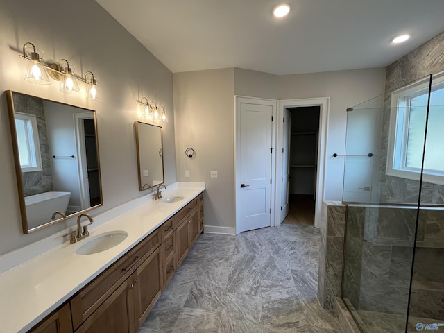 bathroom featuring independent shower and bath and vanity