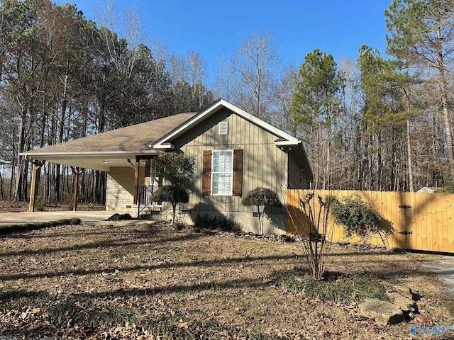 view of property exterior with a carport