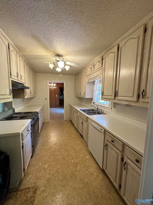 kitchen featuring range with gas stovetop, light brown cabinetry, ceiling fan, sink, and white dishwasher