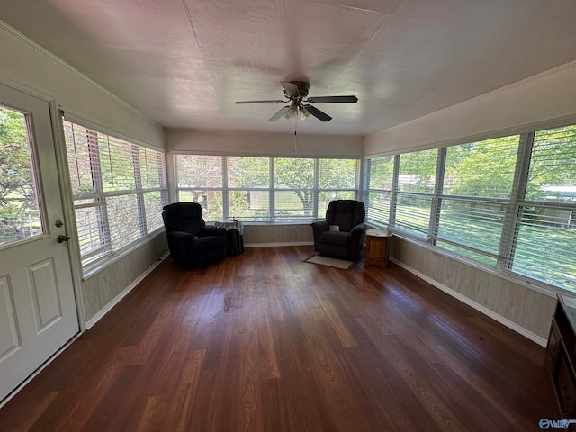 unfurnished sunroom featuring a wealth of natural light and ceiling fan