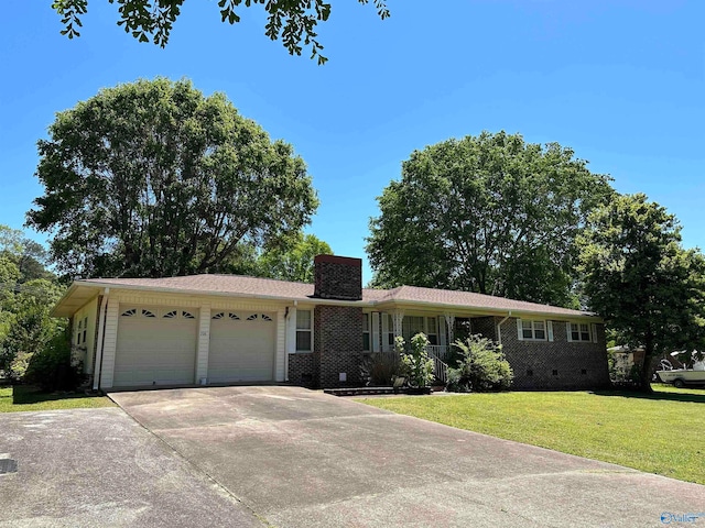 single story home featuring a garage and a front yard