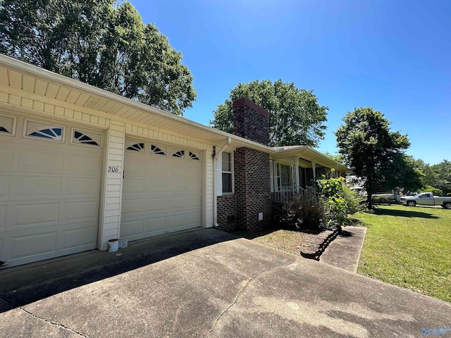 view of front of home with a garage and a front yard