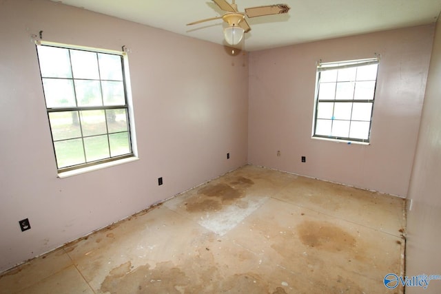 unfurnished room featuring a ceiling fan