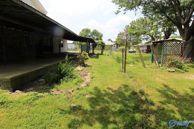 view of yard featuring an attached carport