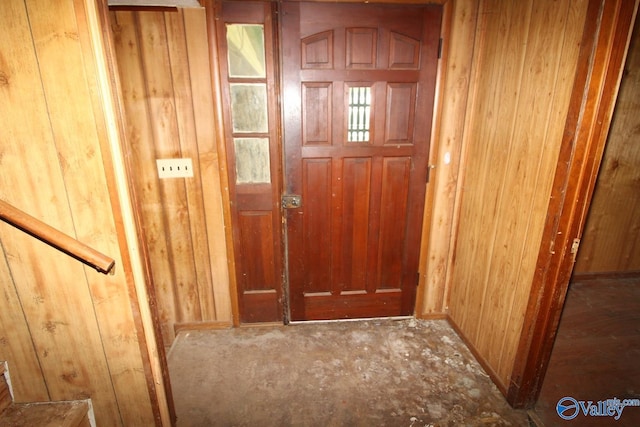 doorway with wooden walls