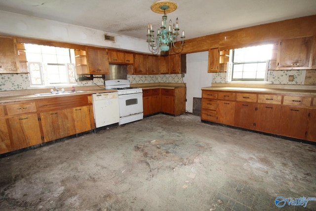 kitchen with white appliances, a sink, light countertops, open shelves, and brown cabinetry