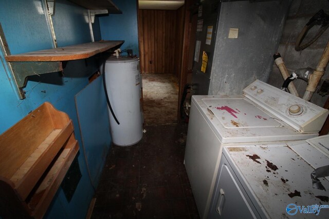 washroom with laundry area, water heater, and washer and clothes dryer