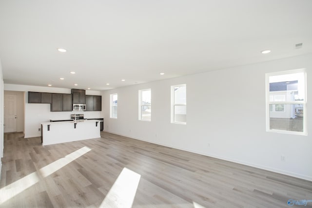 unfurnished living room with light hardwood / wood-style floors